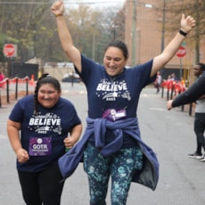 GOTR participant and 5K buddy cross the finish line